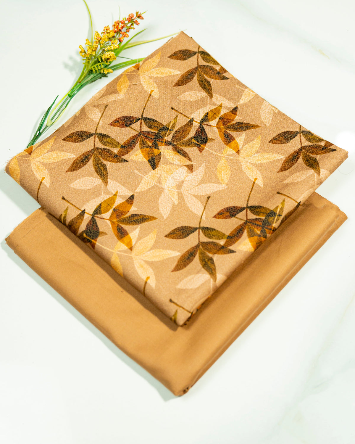 Print fabric with leaf pattern on a white background