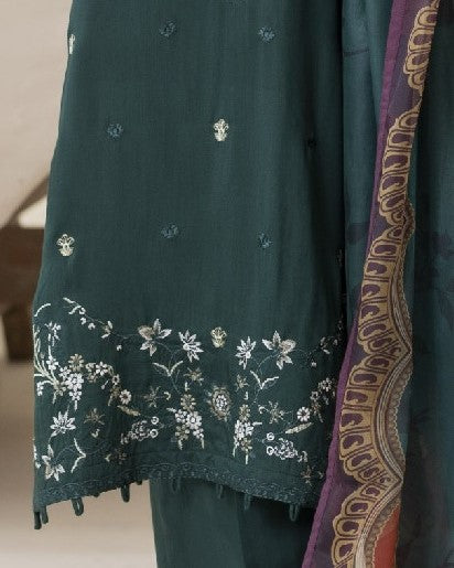 Detailed border view of Amaya’s shirt hem embroidery showcasing motifs and design work