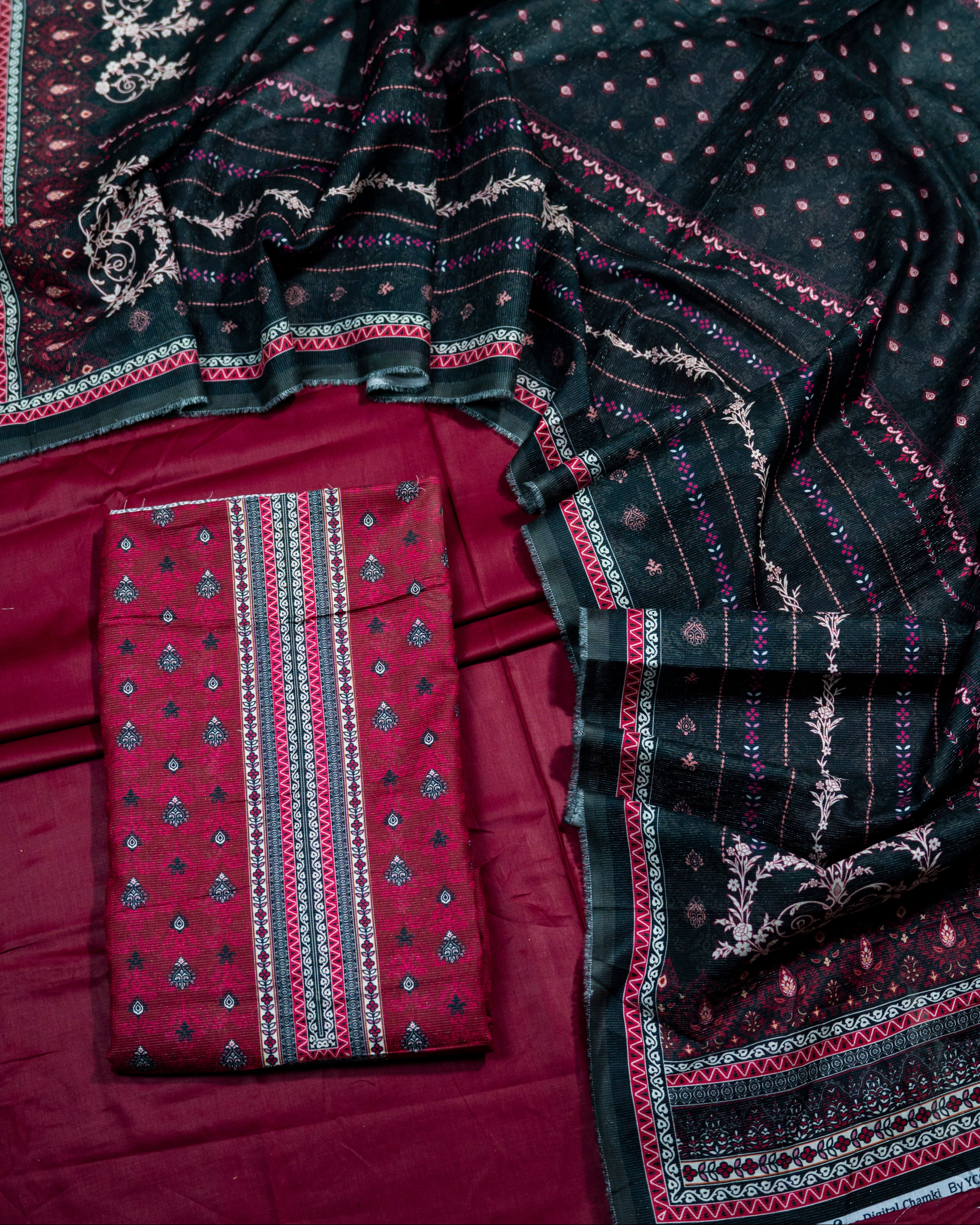 Black and red patterned fabric with a folded piece of fabric on a matching trouser