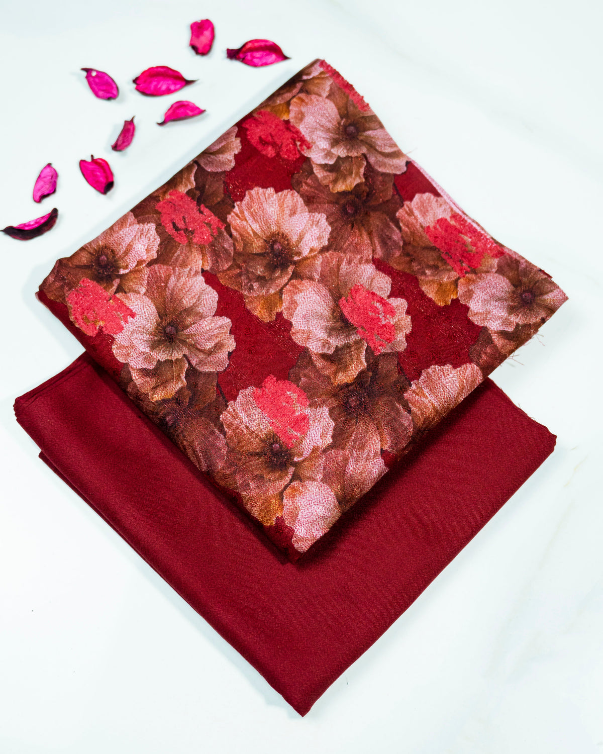 Floral fabric with red and brown pattern on a white background
