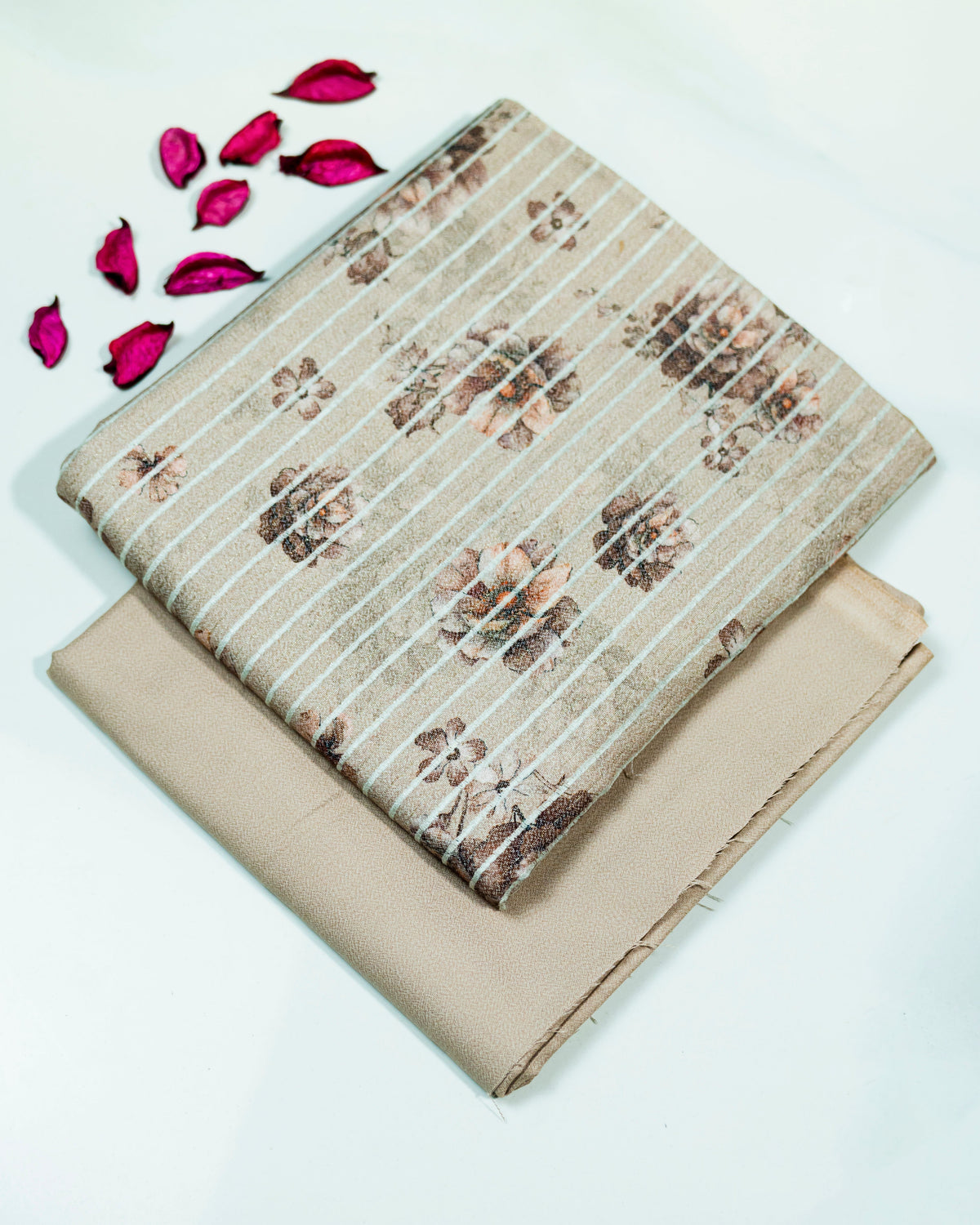 Folded fabric with offwhite print pattern on a white background