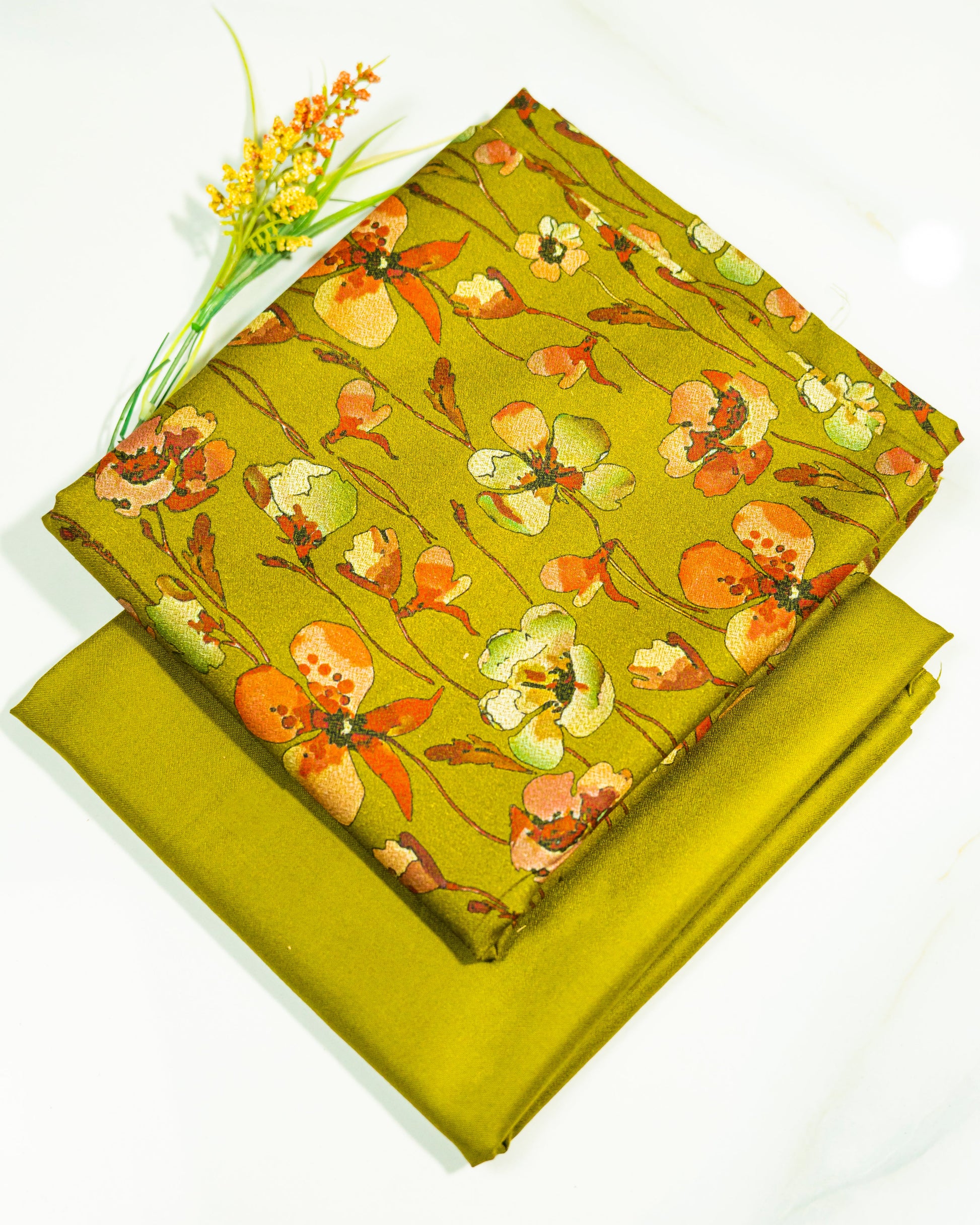 Yellow fabric with floral pattern on a white background