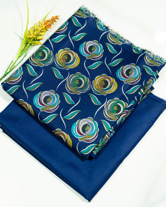 Two blue fabric swatches, one with a floral pattern, on a white background.