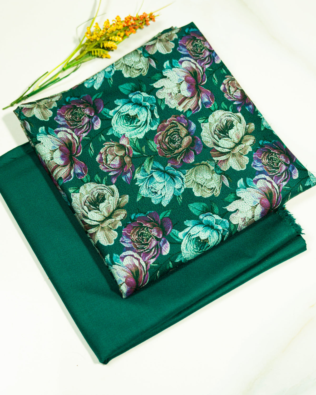 Floral fabric with green background on a white surface