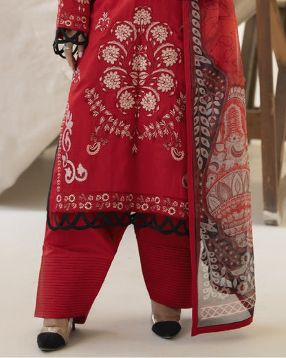 Detailed border view of Miran’s shirt hem revealing elegant embroidery and design flourishes