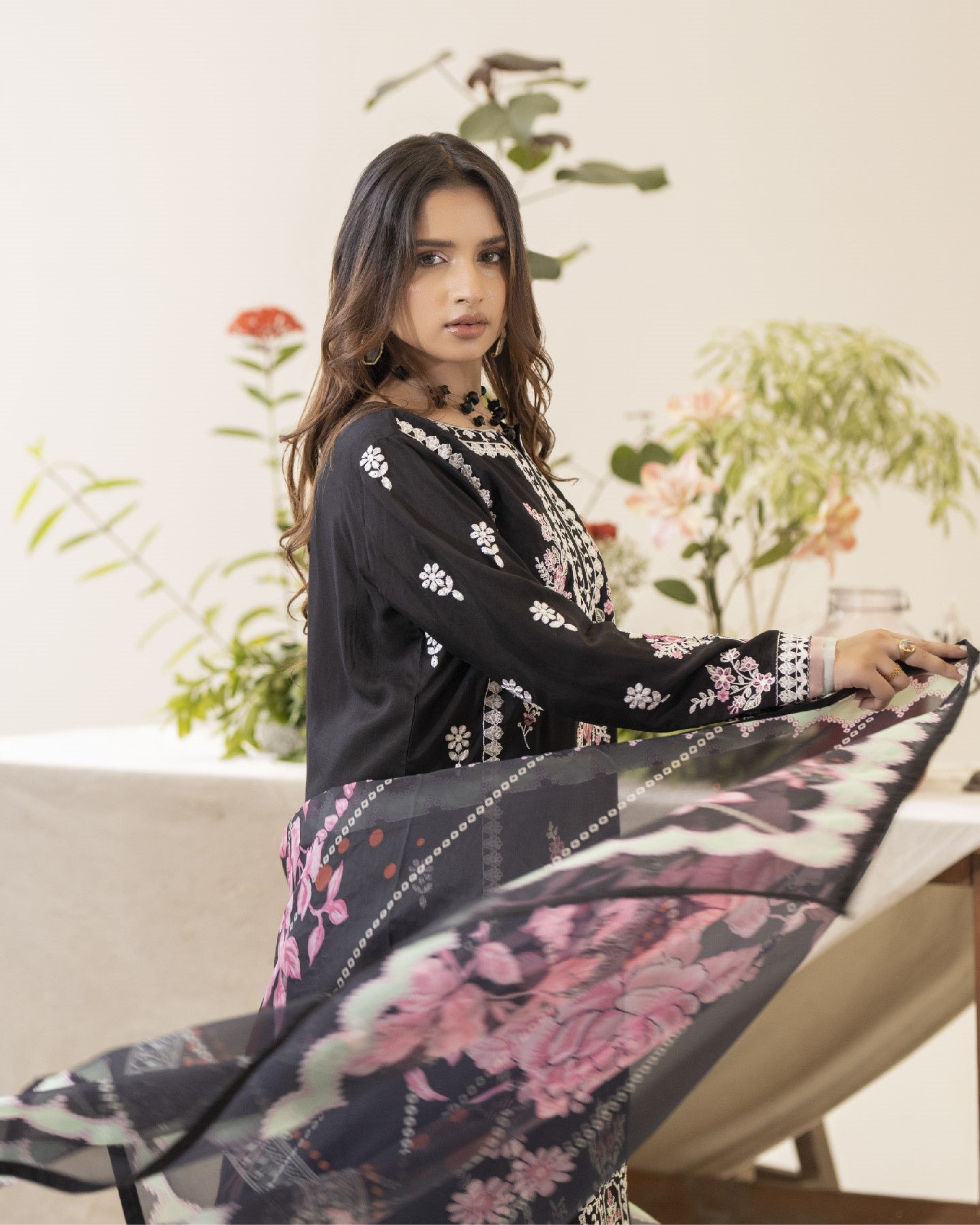 Back view of Nazak showing embroidered back panel of the shirt with coordinated trouser and dupatta