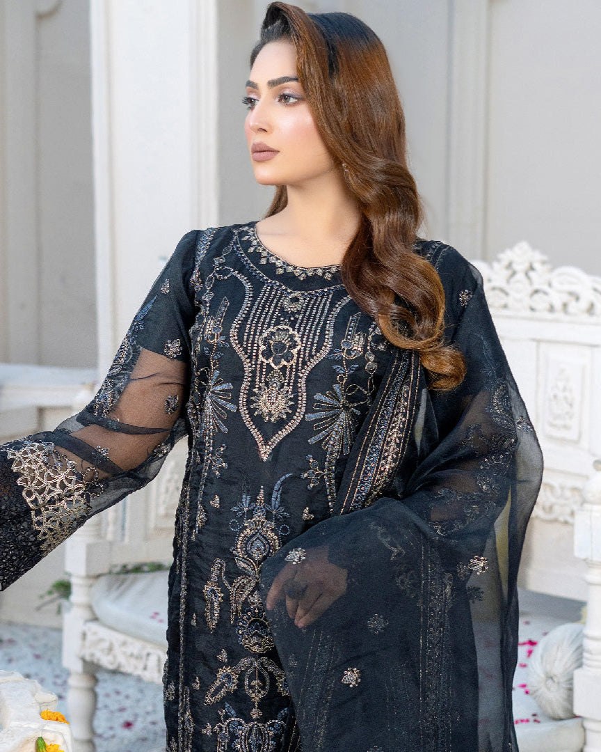 close-up embroidery detail on organza shirt — luxury formal