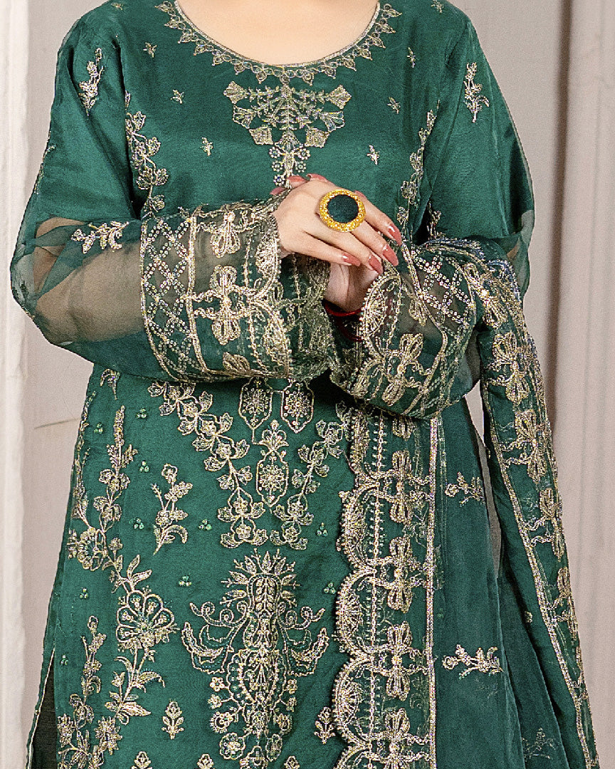 Zamurd Bahar close-up embroidery detail on organza shirt — luxury formal